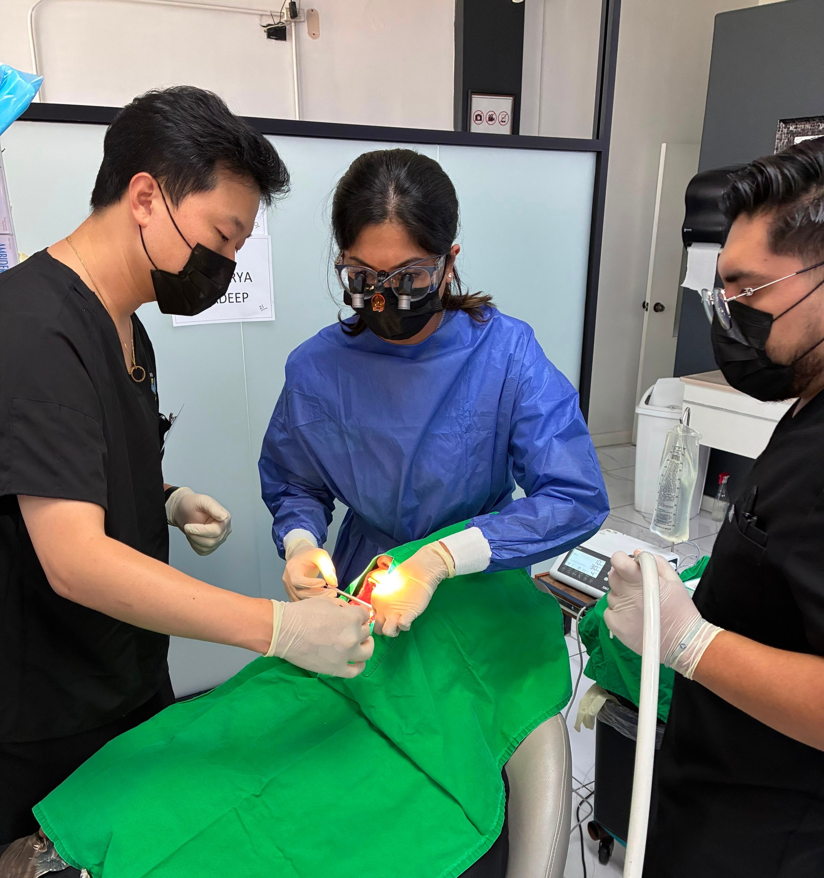 Dr. Choi guiding a participant through implant placement technique during live surgery