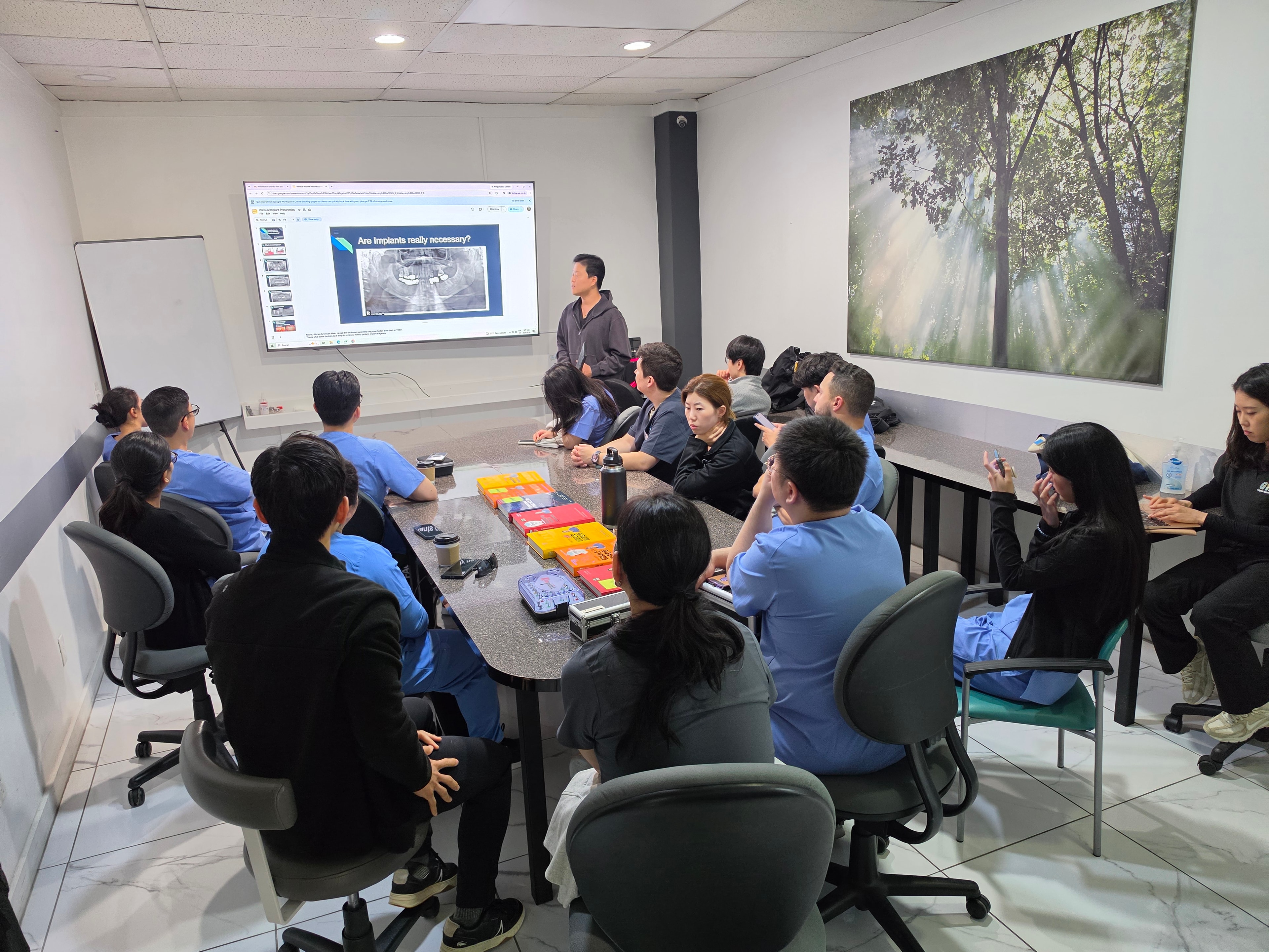 Dr. Choi presenting a lecture on implant dentistry principles to course participants